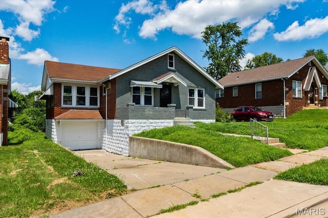 3807 Lawler Dr, Northwoods, MO 63121 - bungalow featuring brick siding, an attached garage, concrete driveway, and a front lawn
