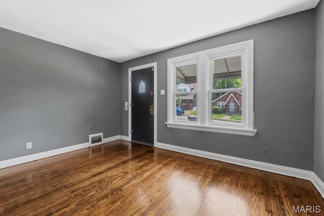 3807 Lawler Dr, Northwoods, MO 63121 - empty room featuring wood finished floors and baseboards