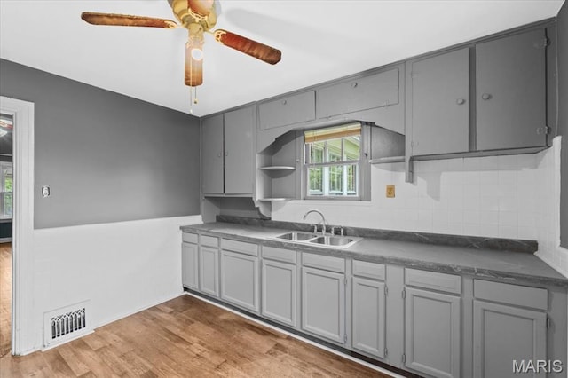 3807 Lawler Dr, Northwoods, MO 63121 - kitchen with gray cabinets, dark countertops, and open shelves