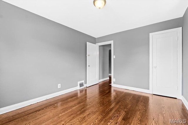 3807 Lawler Dr, Northwoods, MO 63121 - unfurnished bedroom with baseboards and wood finished floors