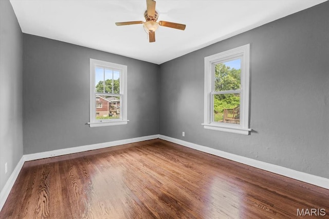 3807 Lawler Dr, Northwoods, MO 63121 - spare room featuring wood finished floors and a ceiling fan