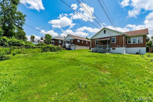 3807 Lawler Dr, Northwoods, MO 63121 - back of house with brick siding and a porch