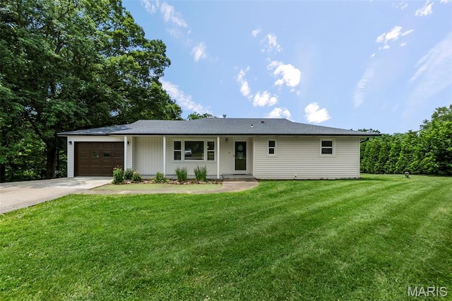 2848 S Hope St, Jackson, MO 63755 - ranch-style home with concrete driveway, a garage, and a front lawn