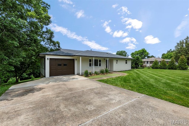 2848 S Hope St, Jackson, MO 63755 - ranch-style house featuring a front yard, an attached garage, and concrete driveway