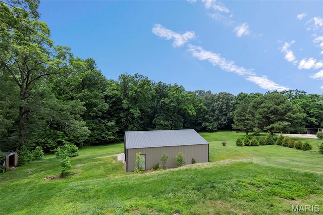 2848 S Hope St, Jackson, MO 63755 - view of grassy yard featuring an outbuilding, an outdoor structure, and a wooded view