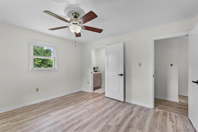 2848 S Hope St, Jackson, MO 63755 - unfurnished bedroom with light wood-style flooring, baseboards, and a ceiling fan