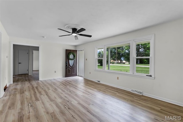 2848 S Hope St, Jackson, MO 63755 - unfurnished living room with baseboards, light wood-style floors, and a ceiling fan