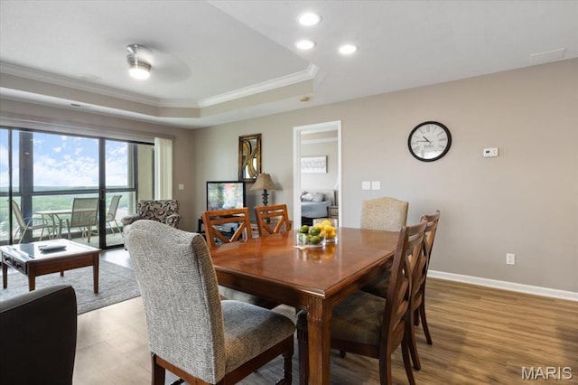 33 Monterey Dr Unit 2A, Lake Ozark, MO 65049 - dining space with ornamental molding, a raised ceiling, light wood-style flooring, baseboards, and recessed lighting