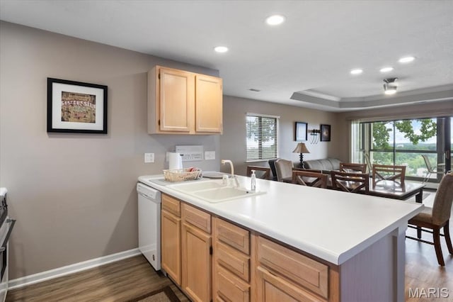 33 Monterey Dr Unit 2A, Lake Ozark, MO 65049 - kitchen featuring a peninsula, white dishwasher, plenty of natural light, a sink, and recessed lighting