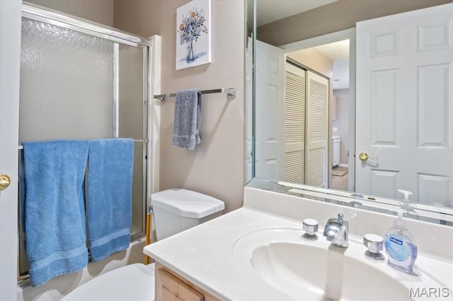 33 Monterey Dr Unit 2A, Lake Ozark, MO 65049 - full bath featuring toilet, vanity, combined bath / shower with glass door, and a closet