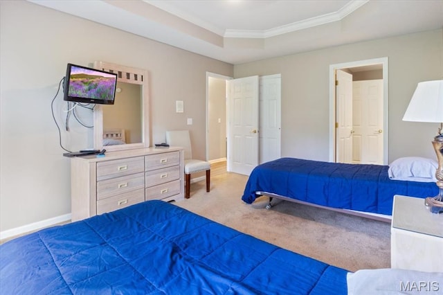 33 Monterey Dr Unit 2A, Lake Ozark, MO 65049 - carpeted bedroom featuring ornamental molding, a tray ceiling, and baseboards