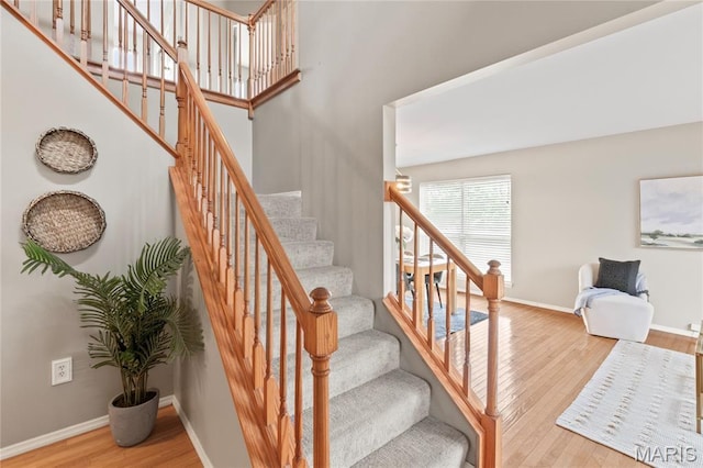 668 Top Notch Ln, Eureka, MO 63025 - stairway featuring wood finished floors and baseboards