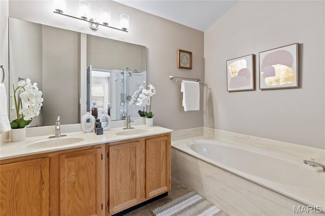 668 Top Notch Ln, Eureka, MO 63025 - bathroom featuring a bath, double vanity, a stall shower, and tile patterned floors