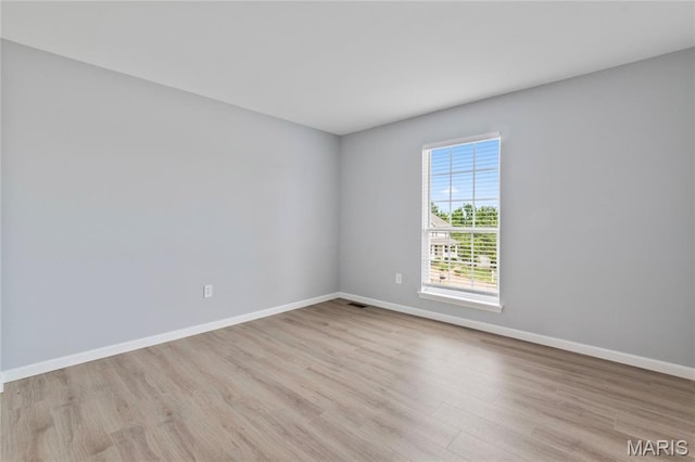668 Top Notch Ln, Eureka, MO 63025 - unfurnished room with wood finished floors and baseboards