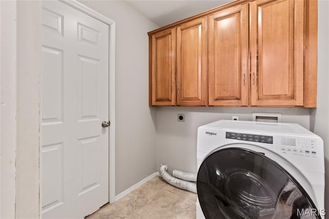668 Top Notch Ln, Eureka, MO 63025 - laundry area with washer / dryer, cabinet space, and baseboards