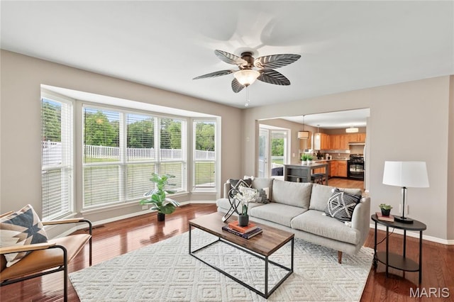 668 Top Notch Ln, Eureka, MO 63025 - living room with a ceiling fan, plenty of natural light, baseboards, and wood finished floors