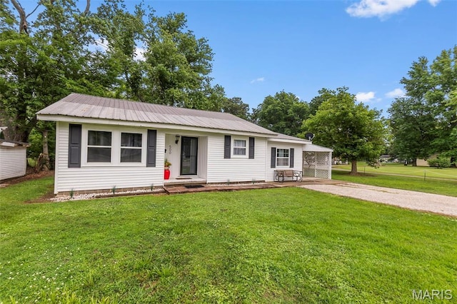 500 Frisco Rd, Campbell, MO 63933 - view of front of house with gravel driveway, a front yard, and metal roof