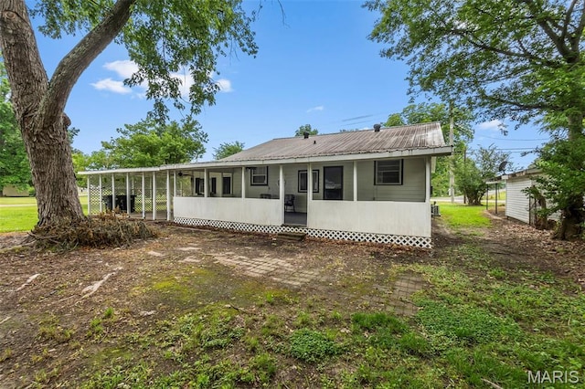 500 Frisco Rd, Campbell, MO 63933 - back of house featuring a sunroom and metal roof