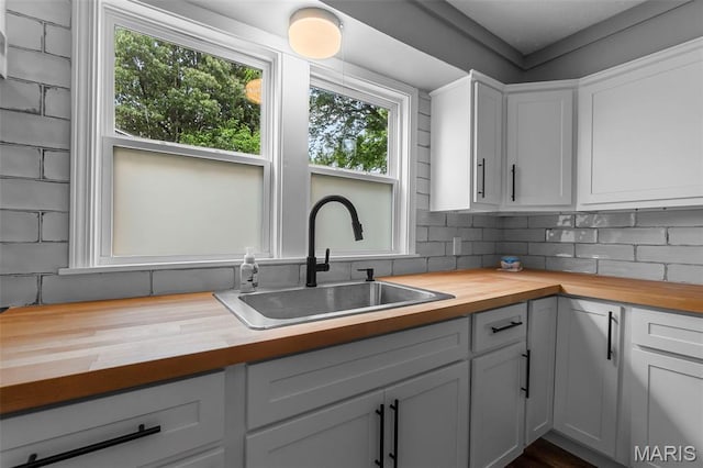 500 Frisco Rd, Campbell, MO 63933 - kitchen with butcher block countertops, a sink, and healthy amount of natural light