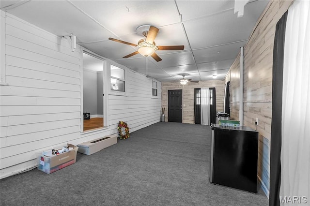 500 Frisco Rd, Campbell, MO 63933 - interior space featuring carpet floors, wooden walls, ceiling fan, and a paneled ceiling