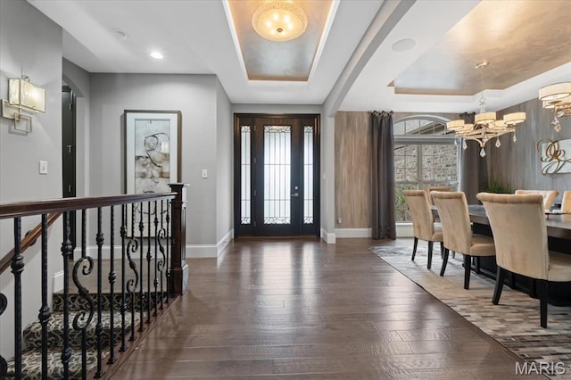 5 Watch Hill Rd, Ladue, MO 63124 - foyer entrance featuring a tray ceiling, wood-type flooring, and a chandelier