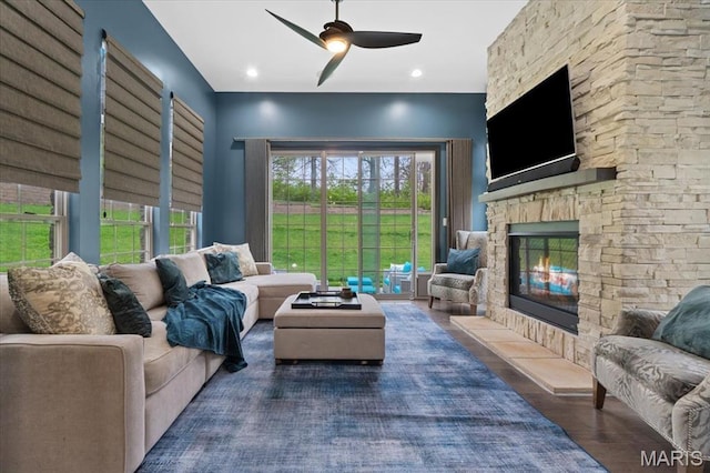 5 Watch Hill Rd, Ladue, MO 63124 - living area featuring ceiling fan, wood finished floors, and a fireplace