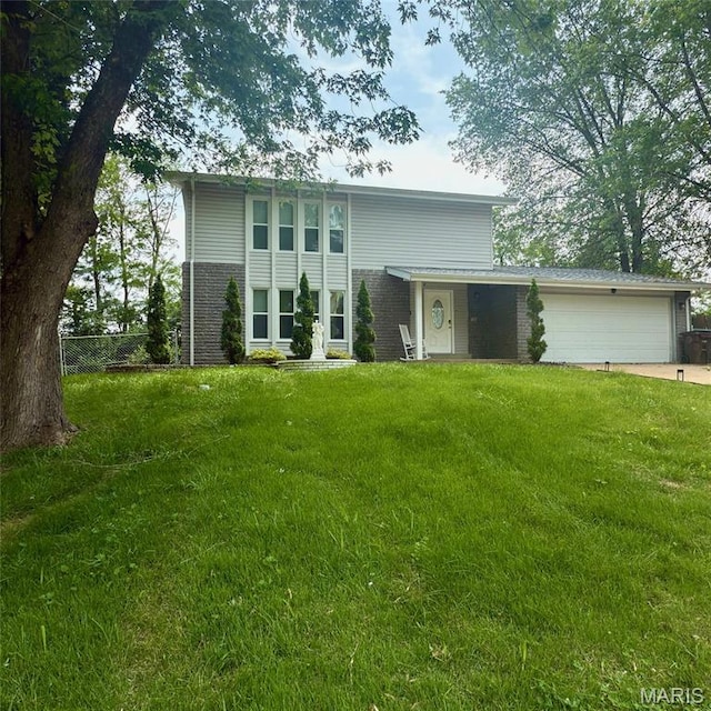 11630 Carolview Dr, Florissant, MO 63033 - view of front of house with brick siding, a garage, and concrete driveway