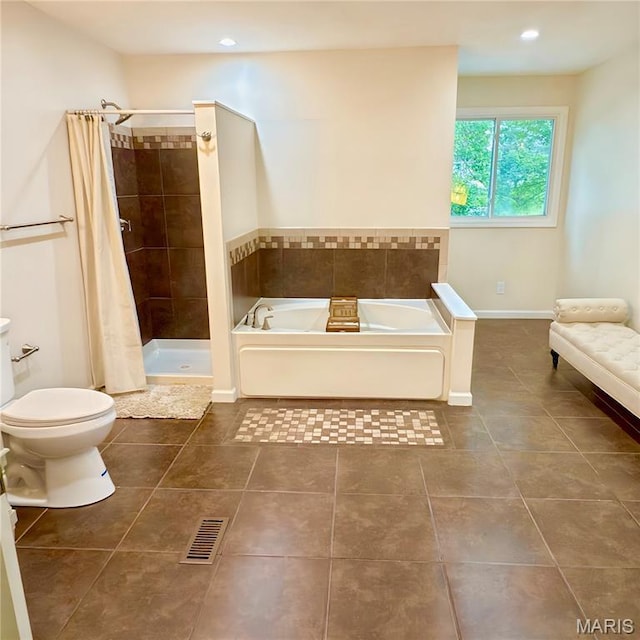 11630 Carolview Dr, Florissant, MO 63033 - bathroom with tile patterned flooring, toilet, a bath, a stall shower, and recessed lighting