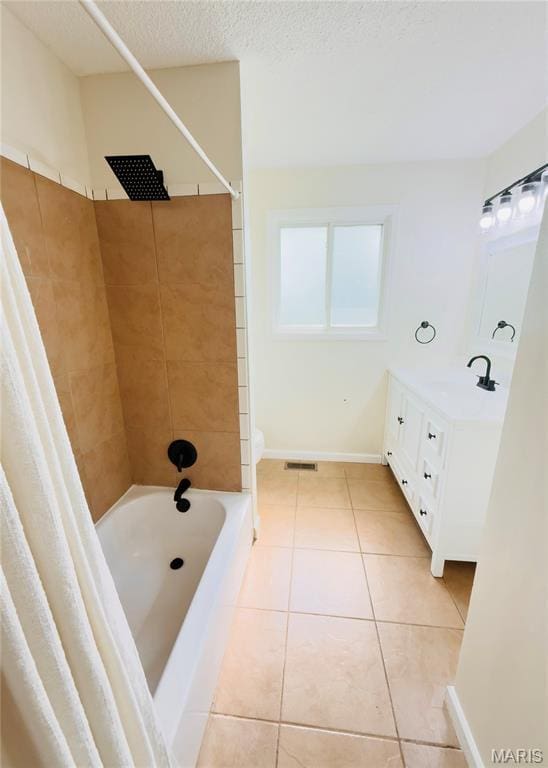 11630 Carolview Dr, Florissant, MO 63033 - bathroom with shower / tub combo, tile patterned floors, vanity, and a textured ceiling