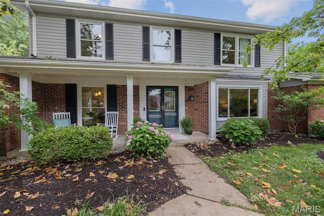 173 Portico Dr, Chesterfield, MO 63017 - view of front of property with brick siding and covered porch