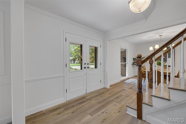173 Portico Dr, Chesterfield, MO 63017 - foyer with stairway, wood-type flooring, ornamental molding, french doors, and baseboards