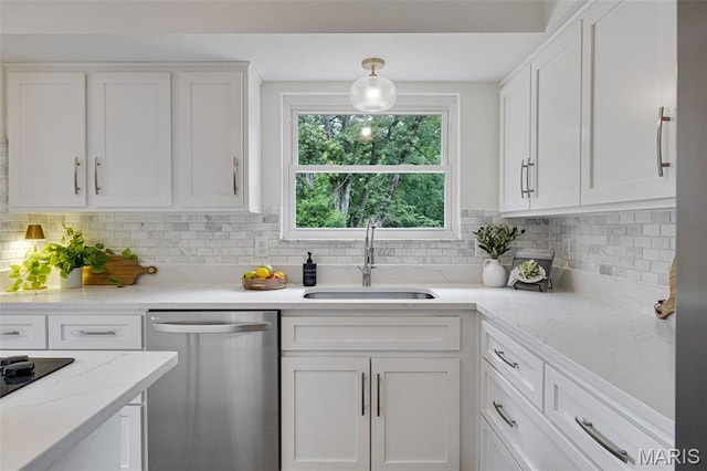 173 Portico Dr, Chesterfield, MO 63017 - kitchen featuring dishwasher, a sink, white cabinetry, and backsplash