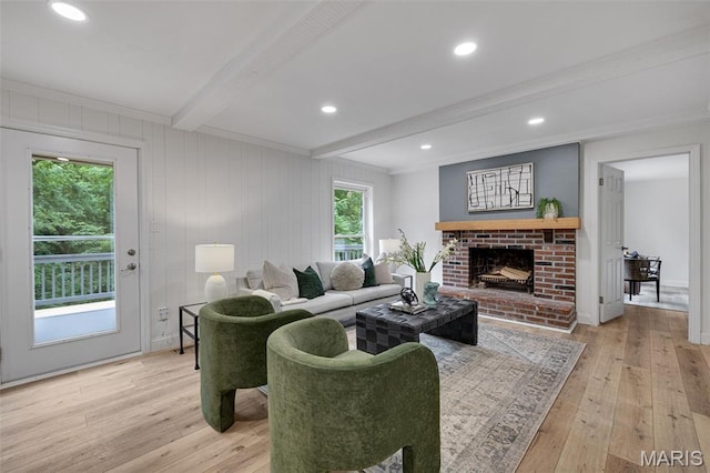 173 Portico Dr, Chesterfield, MO 63017 - living area with beam ceiling, light wood-style floors, a brick fireplace, and ornamental molding