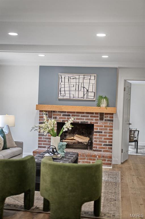 173 Portico Dr, Chesterfield, MO 63017 - living room featuring a fireplace, wood finished floors, recessed lighting, ornamental molding, and baseboards