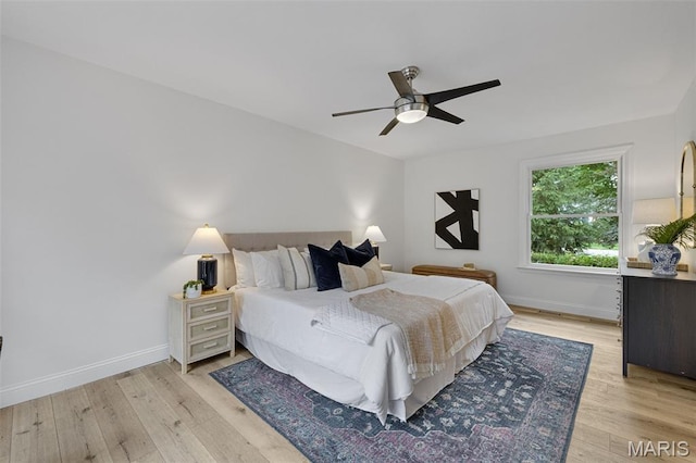 173 Portico Dr, Chesterfield, MO 63017 - bedroom with light wood-style flooring, baseboards, and ceiling fan
