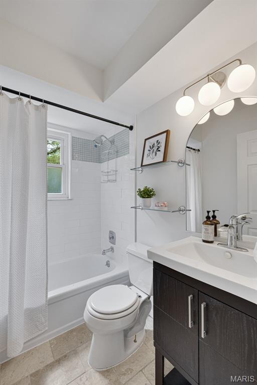 173 Portico Dr, Chesterfield, MO 63017 - bathroom with vanity, toilet, and shower / bathtub combination with curtain