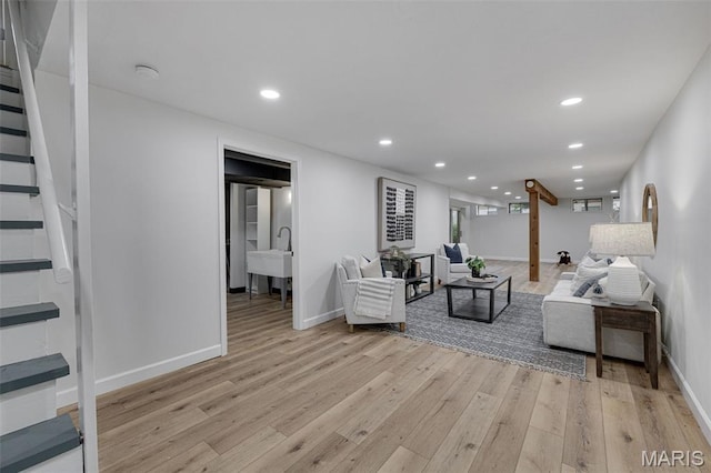 173 Portico Dr, Chesterfield, MO 63017 - living area featuring stairs, recessed lighting, light wood-type flooring, and baseboards