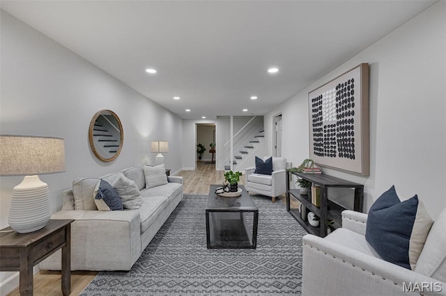 173 Portico Dr, Chesterfield, MO 63017 - living area with wood finished floors, recessed lighting, stairway, and baseboards