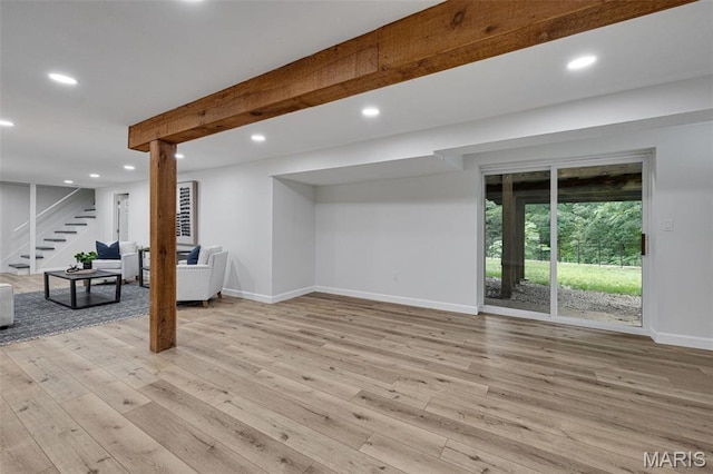 173 Portico Dr, Chesterfield, MO 63017 - below grade area with baseboards, recessed lighting, light wood-style floors, and stairway