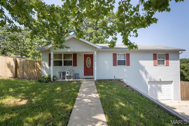 15110 Transit Rd, Saint Robert, MO 65584 - view of front facade featuring an attached garage, covered porch, and driveway