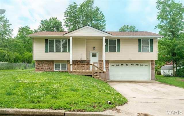 1804 Meadow Ct, Rolla, MO 65401 - raised ranch with an attached garage, concrete driveway, and brick siding