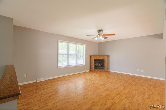 1804 Meadow Ct, Rolla, MO 65401 - unfurnished living room featuring light wood-type flooring, ceiling fan, a fireplace, and baseboards