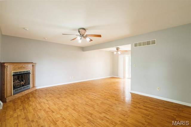 1804 Meadow Ct, Rolla, MO 65401 - unfurnished living room featuring a ceiling fan, light wood finished floors, baseboards, and a fireplace