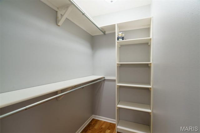 1804 Meadow Ct, Rolla, MO 65401 - walk in closet featuring wood finished floors