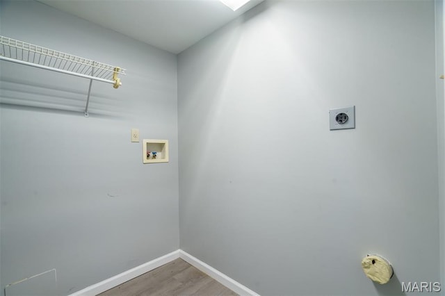 1804 Meadow Ct, Rolla, MO 65401 - laundry room featuring hookup for an electric dryer, washer hookup, light wood-style flooring, and baseboards