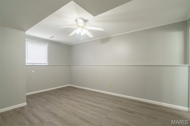 1804 Meadow Ct, Rolla, MO 65401 - empty room featuring ceiling fan, wood finished floors, baseboards, and ornamental molding