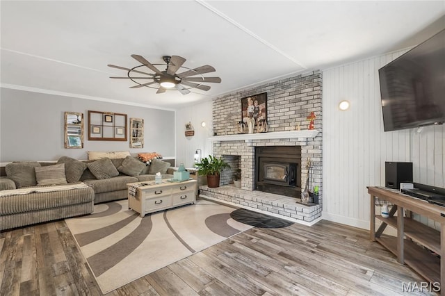 116 Shirewood Dr, Saint Charles, MO 63303 - living area with a brick fireplace, ceiling fan, wood finished floors, and crown molding