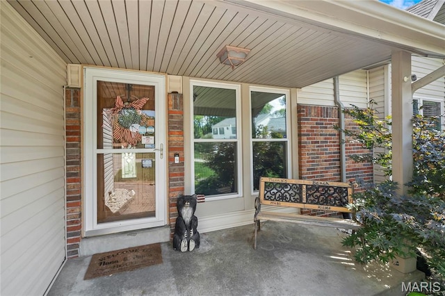116 Shirewood Dr, Saint Charles, MO 63303 - property entrance featuring covered porch and brick siding