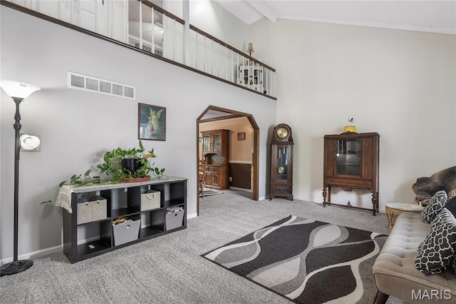 116 Shirewood Dr, Saint Charles, MO 63303 - living room featuring carpet, arched walkways, high vaulted ceiling, and ornamental molding