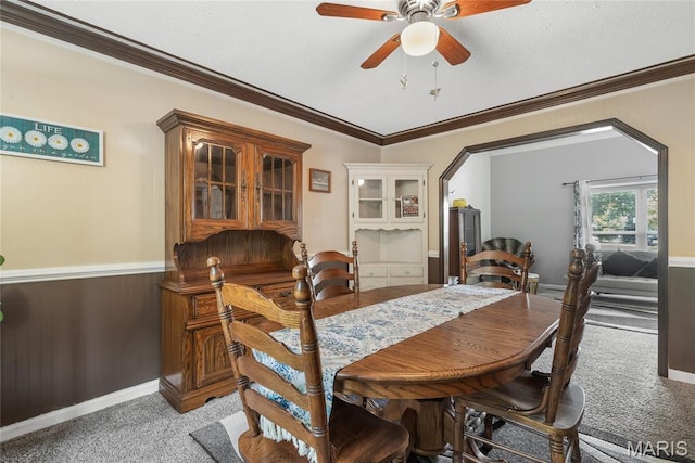 116 Shirewood Dr, Saint Charles, MO 63303 - dining space with light colored carpet, a ceiling fan, ornamental molding, and arched walkways